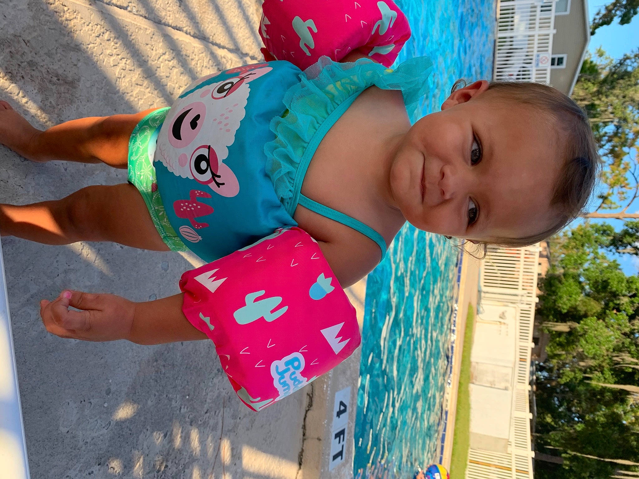 Ariella is registered to the contest to win money with this photo: baby, child, electric_blue, fun, happy, hat, human_leg, leisure, magenta, pattern, person, pink, public_space, recreation, sky, summer, thigh, toddler, tree, trunk