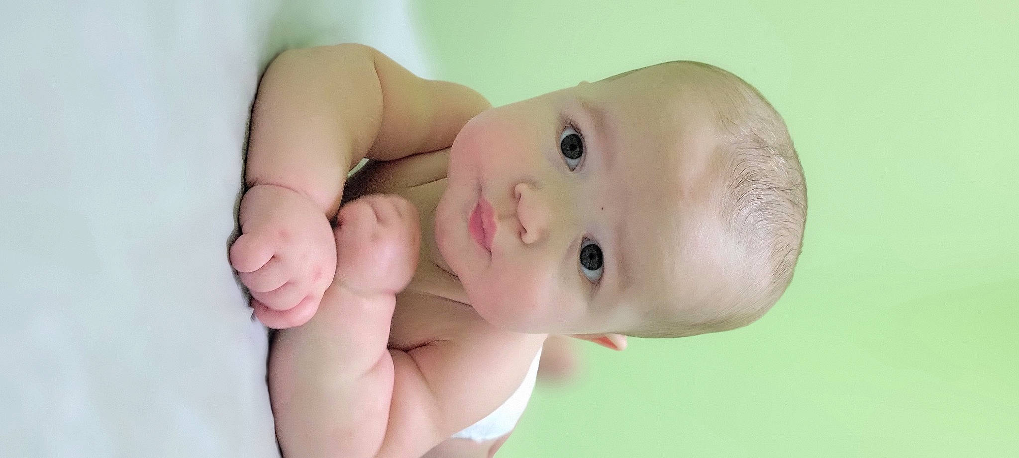 Gregory is registered to the contest to win money with this photo: arm, baby, cheek, chest, eye, eyebrow, eyelash, finger, gesture, happy, human_body, iris, lip, mouth, neck, nose, person, skin, stomach, thumb