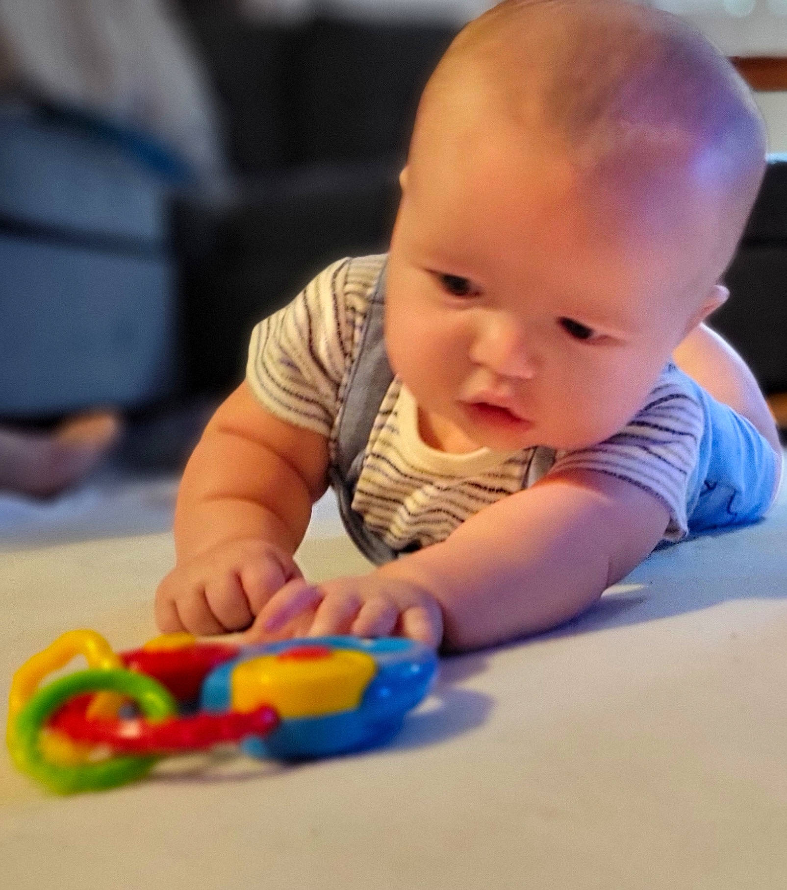 Gregory joined the competition — help win amazing prizes! baby, baby_playing_with_toys, baby_toddler_clothing, cheek, child, finger, flooring, fun, leisure, person, play, room, sitting, toddler