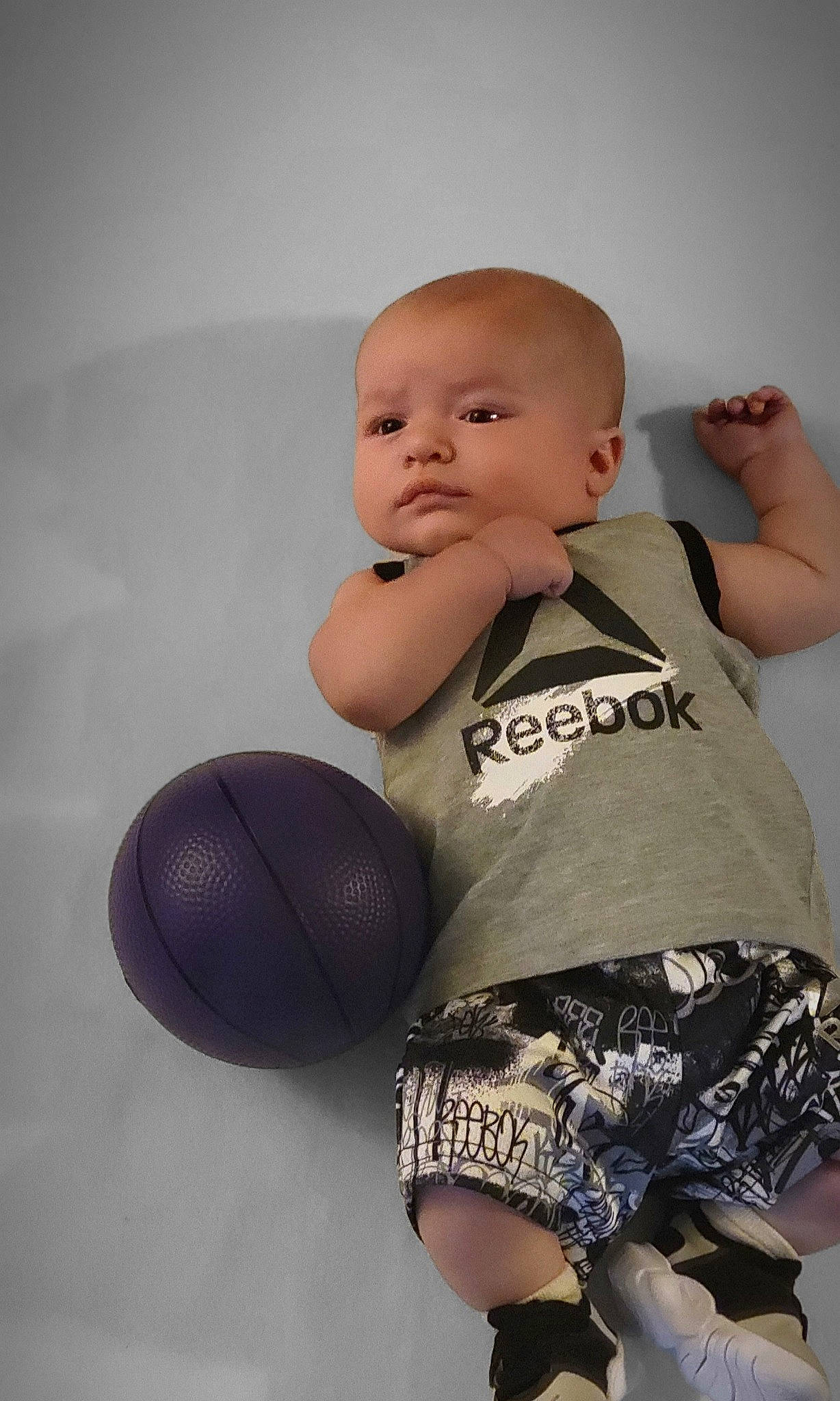 Gregory is registered to the contest to win money with this photo: baby_toddler_clothing, ball, chest, elbow, finger, flash_photography, happy, joint, knee, leg, person, shoulder, skin, sleeve, sports_equipment, sportswear, stomach, thigh, toddler, trunk