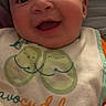 Lucas joined the competition — help win amazing prizes! baby, smiling, face, bib, clothing, infant, cute, happy, child, portrait, closeup, hand, orange_clothing, avocado, illustration, text, soft_lighting, indoors, young, person