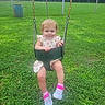 Jurnie joined the competition — help win amazing prizes! child, toddler, baby, swing, playground, outdoor, grass, park, smiling, happy, portrait, face, blonde_hair, dress, strawberry_pattern, shoes, sneakers, pink, chains, fence