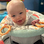 Sawyer joined the competition — help win amazing prizes! baby, infant, child, walker, toy, colorful, smiling, happy, indoor, portrait, face, hand, clothing, seat, playtime, cute, young, home, bright, expression