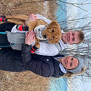 Leo joined the competition — help win amazing prizes! child, facial_expression, fun, fur, grass, happy, hat, lap, leisure, people_in_nature, plant, recreation, sitting, sky, smile, spring, thigh, tree, twig, winter