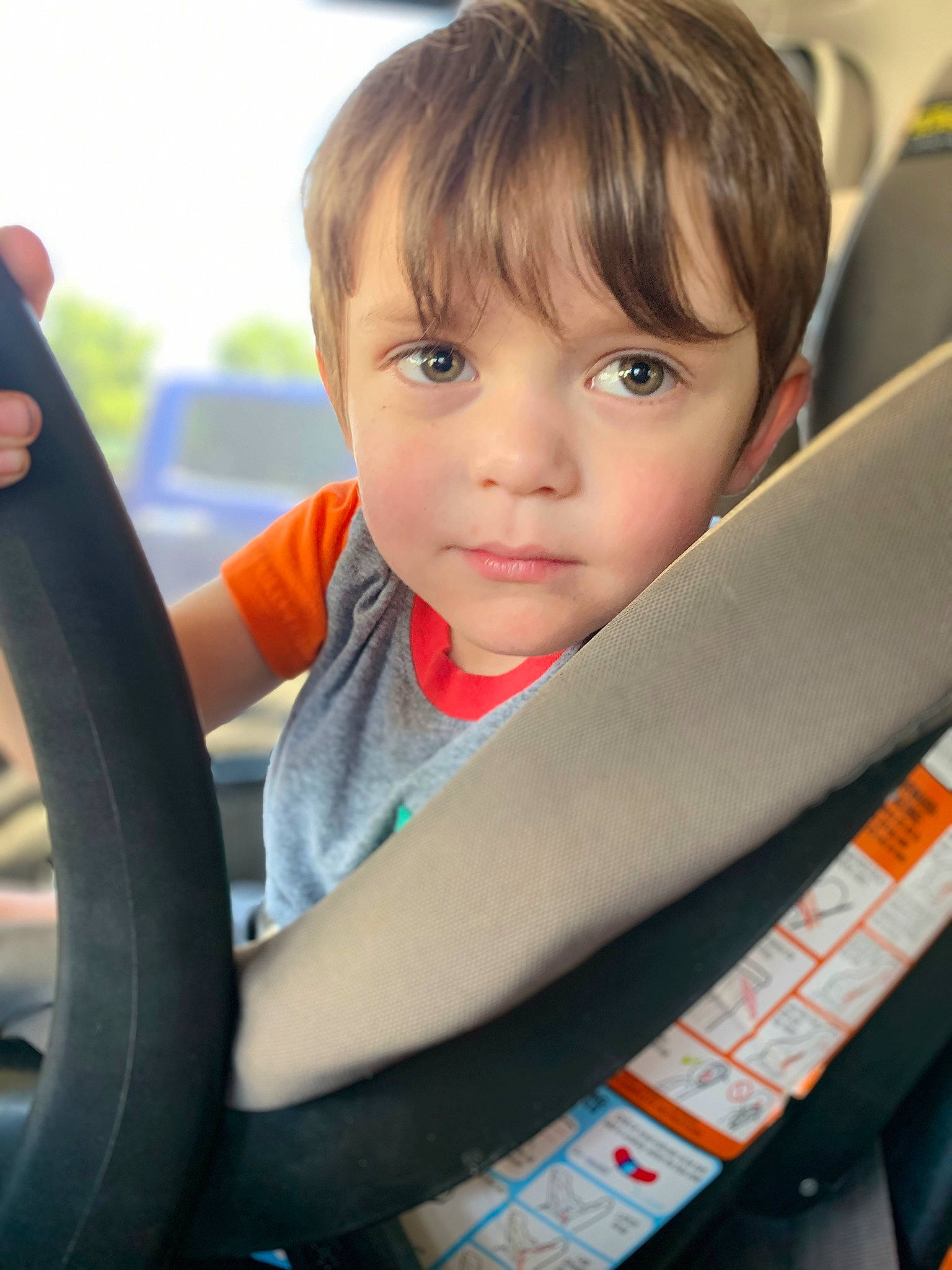 Abram is registered to the contest to win money with this photo: auto_part, automotive_tire, baby, baby_in_car_seat, car_seat, child, child_model, driving, person, rim, seat_belt, sitting, smile, steering_wheel, tire, toddler, wheel