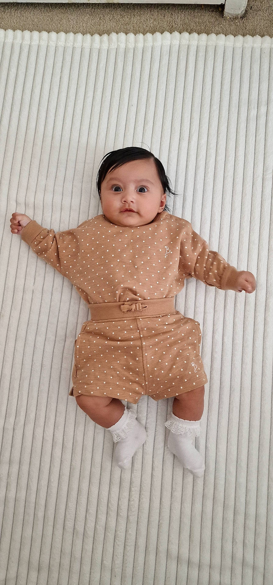 Yanis is registered to the contest to win money with this photo: baby, bodypart, clothing, couch, dress, face, finger, furniture, hand, head, homedecor, hosiery, longsleeve, newborn, pants, person, photography, portrait, sleeve, sock