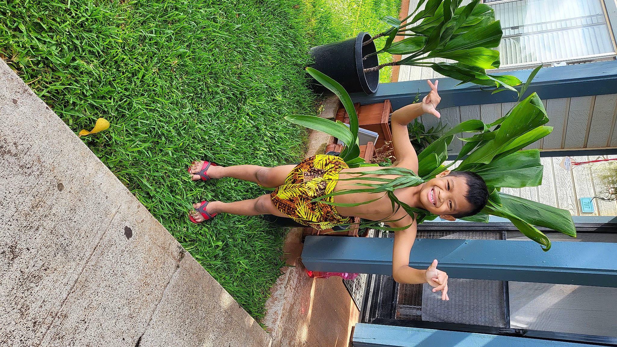 Teyzen joined the competition — help win amazing prizes! foot, fun, garden, grass, human_leg, joy, leisure, outdoor_furniture, people_in_nature, person, plant, recreation, road_surface, sandal, shadow, shrub, sidewalk, sitting, thigh