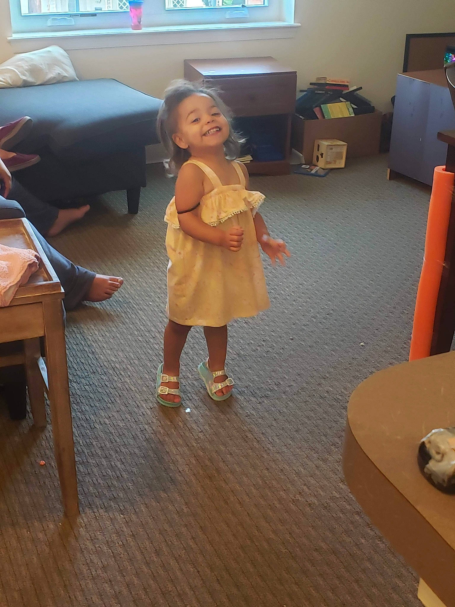 Effie is registered to the contest to win money with this photo: chair, child, floor, flooring, fun, furniture, hardwood, joint, joy, laminate_flooring, leg, person, play, room, shoulder, standing, table, toddler, wood, wood_flooring