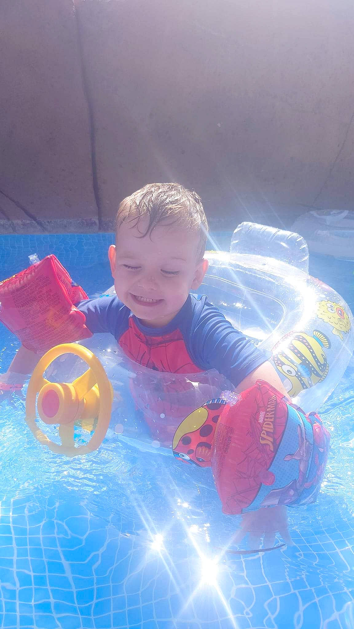 Freddie is registered to the contest to win money with this photo: baby, baby_toddler_clothing, baby_toys, ball, child, electric_blue, fun, games, glass, happy, inflatable, joy, leisure, person, personal_protective_equipment, play, recreation, smile, space, toddler