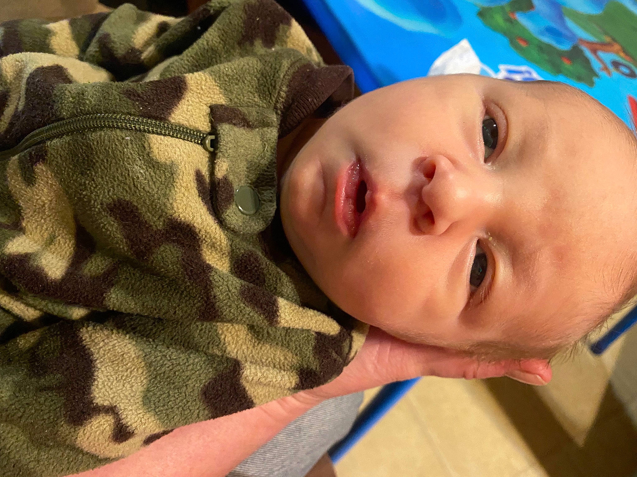 Gunner is registered to the contest to win money with this photo: baby, baby_products, baby_toddler_clothing, cheek, child, comfort, eyebrow, eyelash, happy, iris, leisure, linens, lip, nose, pattern, person, portrait_photography, skin, sleeve, toddler