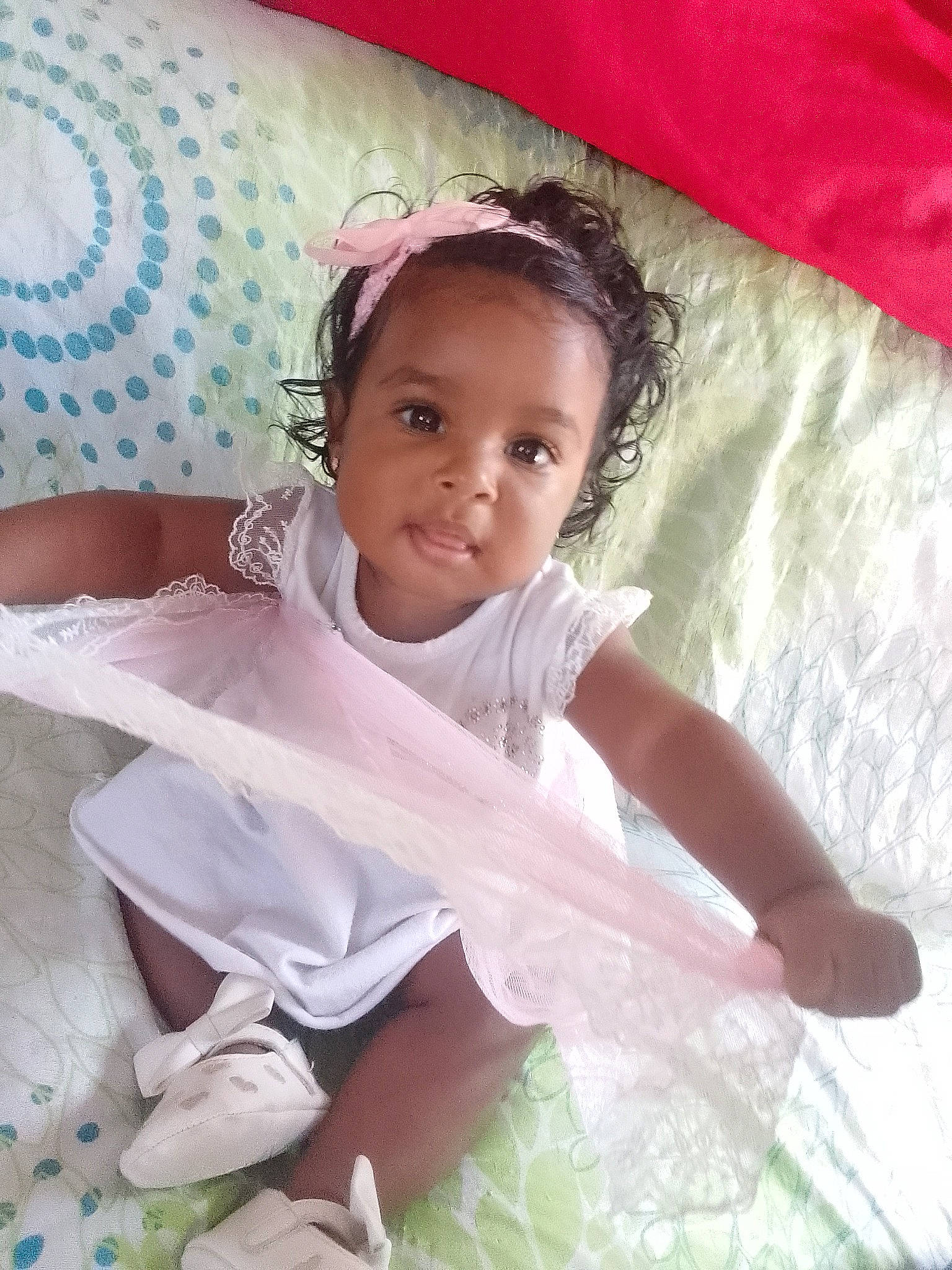 Shanna participe au concours pour gagner de l'argent avec cette photo : baby, baby_toddler_clothing, bridal_accessory, comfort, dress, eye, eyelash, face, hair, hairstyle, happy, head, human_body, iris, linens, person, pink, skin, sleeve, toddler