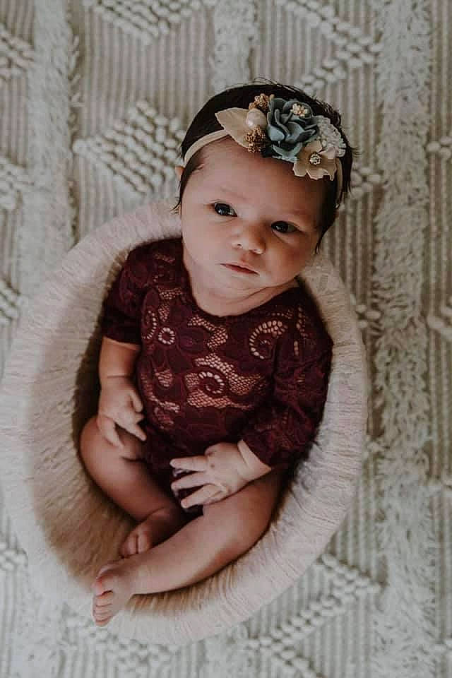 Lauren is registered to the contest to win money with this photo: baby, baby_toddler_clothing, cheek, child, embellishment, eye, face, flash_photography, head, headband, headpiece, headwear, iris, jewellery, lip, pattern, person, pink, skin, sleeve