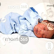 Korian is registered to the contest to win money with this photo: newborn, baby, sleeping, blue_outfit, white_background, infant, peaceful, lying_down, portrait, watermark, branding, cute, child, soft, resting, young, human, indoors, closeup, face