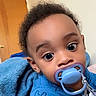 Korian joined the competition — help win amazing prizes! baby, pacifier, blue_blanket, blue_clothing, indoor, door, curly_hair, wide_eyes, face, child, infant, cute, portrait, blanket, person, sleepwear, toddler, expression, closeup, baby_boy