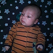 Jason joined the competition — help win amazing prizes! baby, infant, sleepwear, onesie, dinosaur_patch, striped_clothing, star_pattern, blanket, lying_down, face, head, hand, arm, nightwear, cute, child, indoors, soft_lighting, young_child, calm