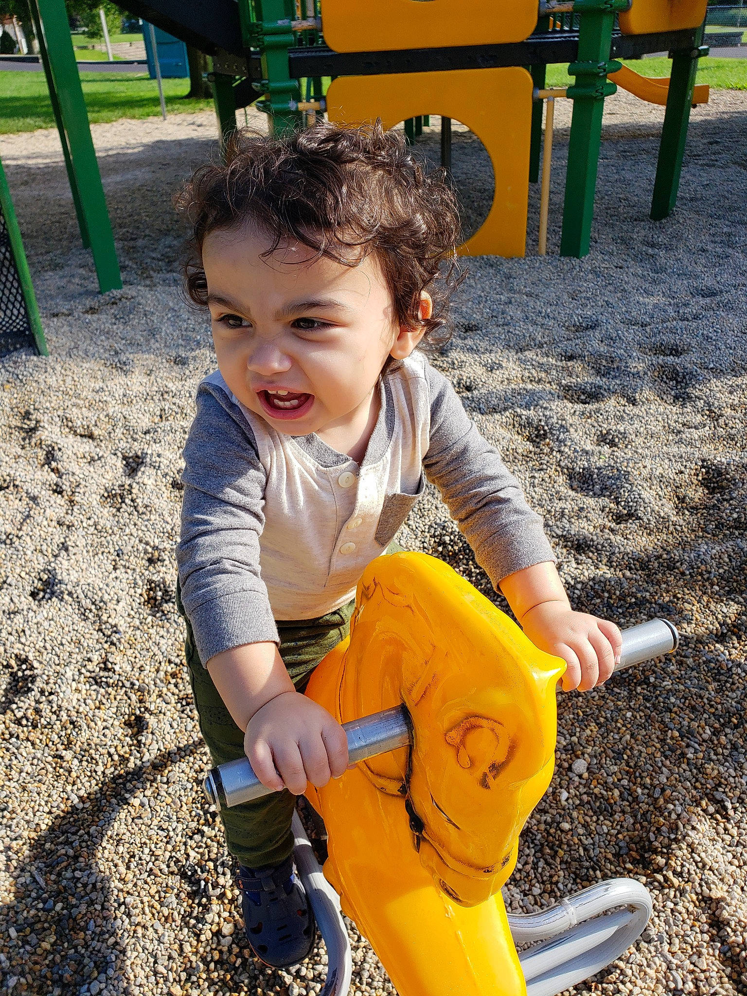 Ryan Stephen is registered to the contest to win money with this photo: child, city, fun, human_settlement, leisure, outdoor_play_equipment, person, play, playground, public_space, recreation, smile, toddler, vacation, yellow