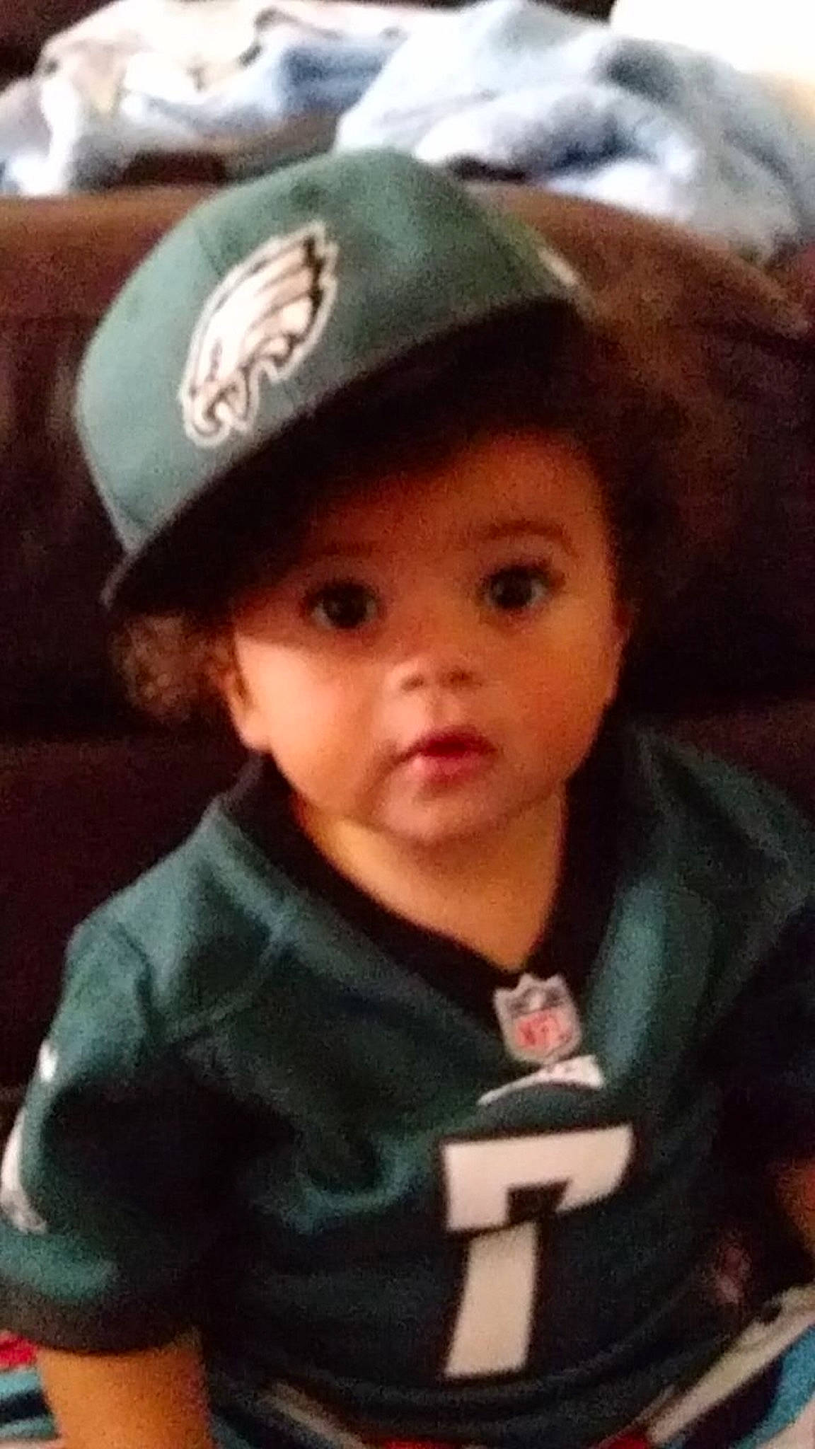 Jeramiah is registered to the contest to win money with this photo: baby, black_hair, brown_hair, cheek, child, cool, fashion_accessory, hat, head, headgear, person, smile, surprise, toddler