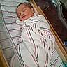 James joined the competition — help win amazing prizes! newborn, baby, swaddled, blanket, striped, sleeping, bassinet, hospital, infant, face, peaceful, resting, wooden, clear, plastic, bed, soft_lighting, portrait, cute, child