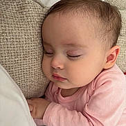 Liva a rejoint le concours — aidez-le/la à gagner de superbes lots ! baby, infant, sleeping, pink_clothing, couch, pillow, closeup, cheek, eyelashes, hand, ear, portrait, soft_texture, blanket, resting, peaceful, indoors, skin, nursery, cute