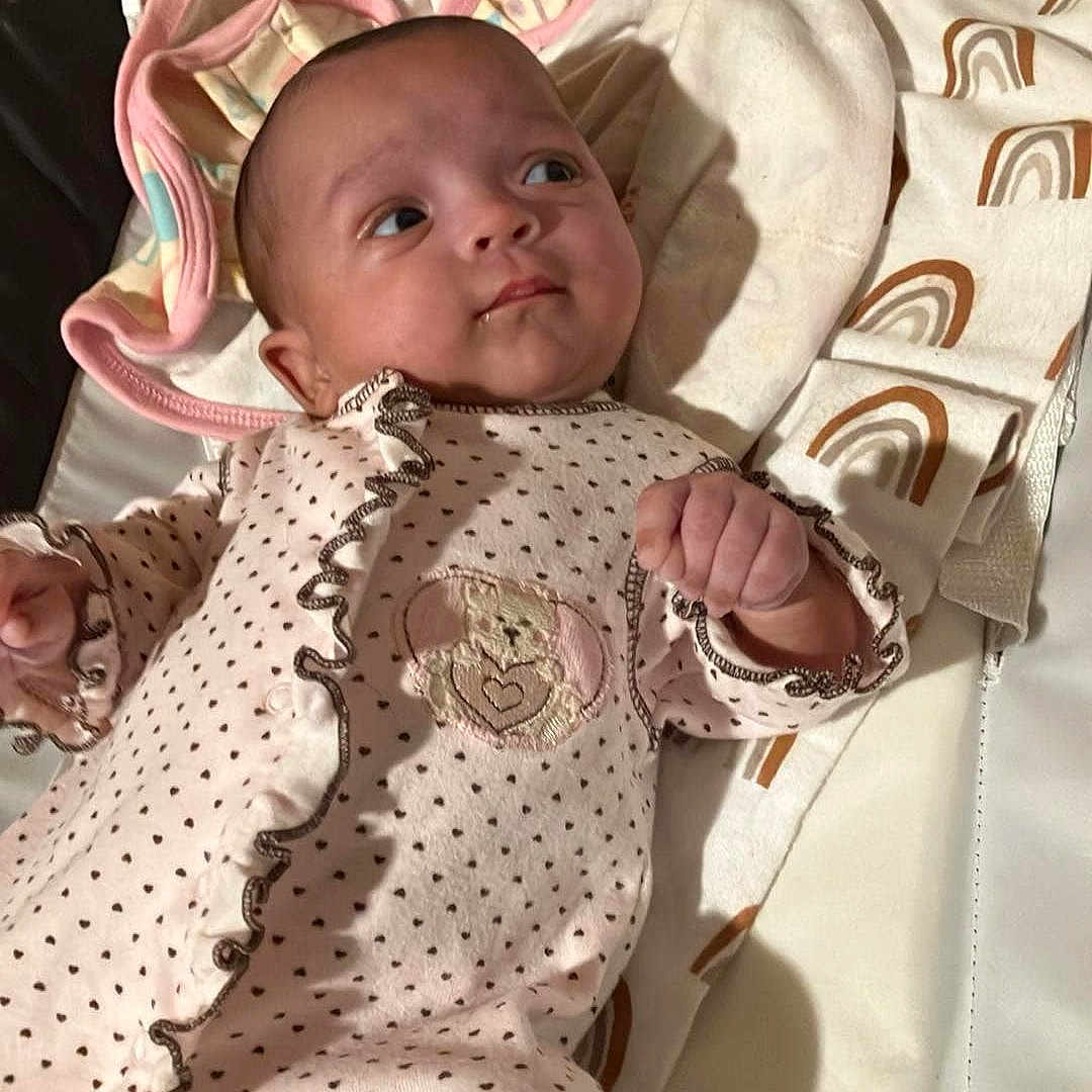 Skye joined the competition — help win amazing prizes! baby, bed, blanket, bonnet, clothing, crib, cushion, face, furniture, hat, head, homedecor, infantbed, newborn, person, photography, portrait, quilt, sleeping, sleeve