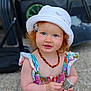 toddler, child, hat, red_hair, blue_eyes, necklace, dress, rock, outdoor, sunhat, smile, portrait, person, cute, young_child, summer, colorful_clothing, skin, hand, nature