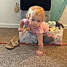 Lilly is registered to the contest to win money with this photo: baby, blonde_hair, blue_eyes, cable, carpet, child, clothes, crawling, curious, face, home, indoor, laundry, laundry_bin, playful, portrait, sandal, smiling, storage, toddler