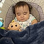 Liam joined the competition — help win amazing prizes! baby, sleeping, plush_toy, blanket, infant, cozy, cute, indoor, child, clothing, seat, comfort, peaceful, resting, adorable, hair, face, soft, nap, young