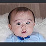 baby, infant, face, blue_bow, clothing, wide_eyes, expression, fluffy, white_background, portrait, cute, child, indoor, head, skin, person, young, looking, sitting, baby_girl_or_boy
