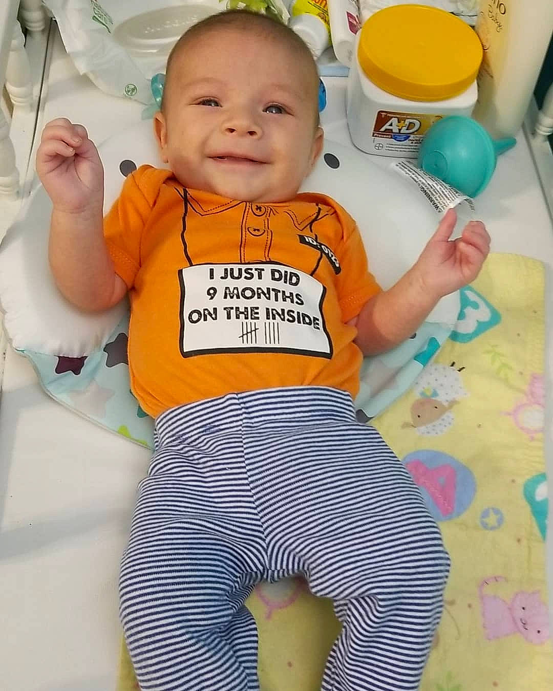 Nikolas is registered to the contest to win money with this photo: active_pants, baby, baby_laughing, baby_products, baby_safety, baby_toddler_clothing, child, human_body, joy, pajamas, person, plastic, product, sweatpant, toddler