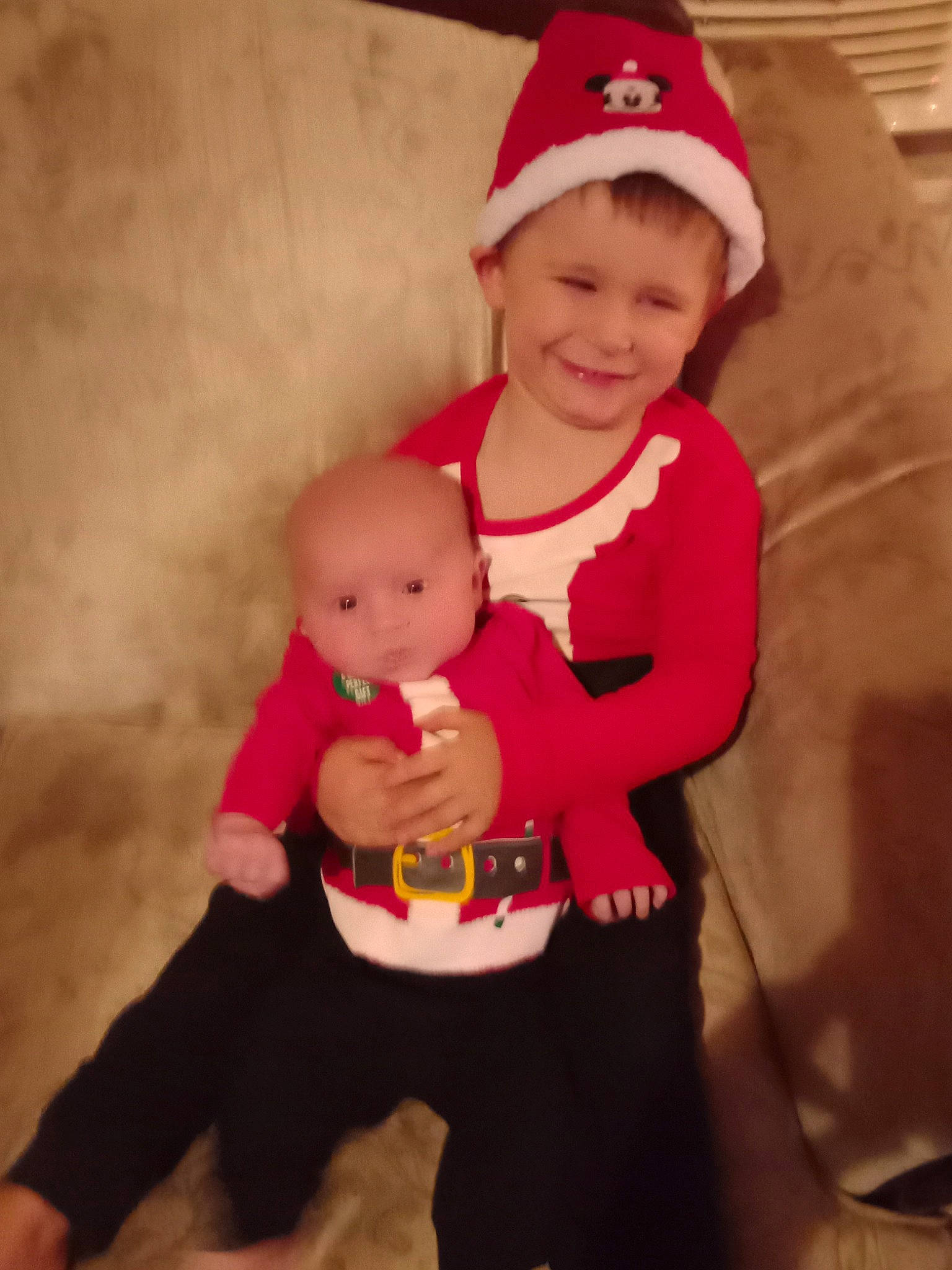 Colin is registered to the contest to win money with this photo: abdomen, baby, baby_toddler_clothing, baseball_cap, cap, eye, face, fun, happy, headwear, human_leg, joy, knee, lap, person, pink, sleeve, smile, stomach, t_shirt