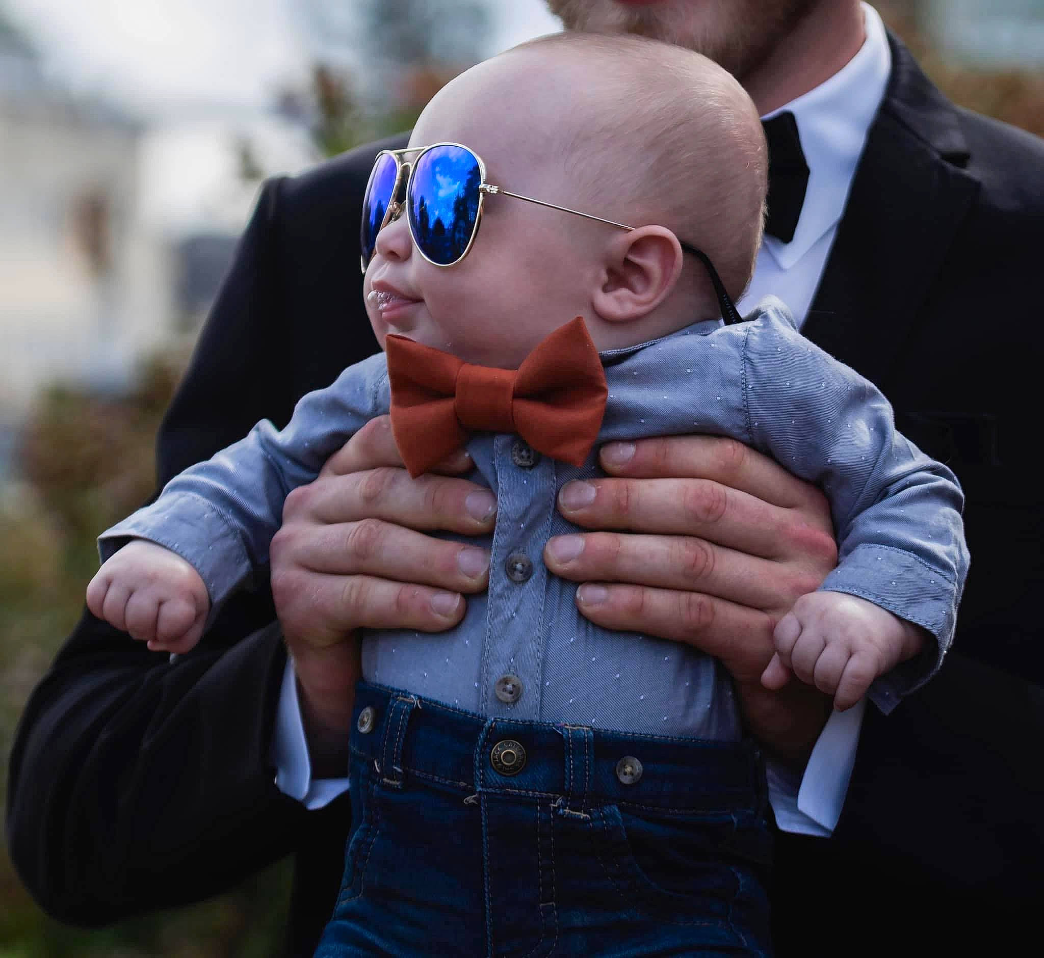 Blayke is registered to the contest to win money with this photo: baby, cap, child, electric_blue, eyewear, finger, fun, gesture, goggles, hand, happy, nail, person, personal_protective_equipment, sleeve, street_fashion, sunglasses, t_shirt, thumb, toddler