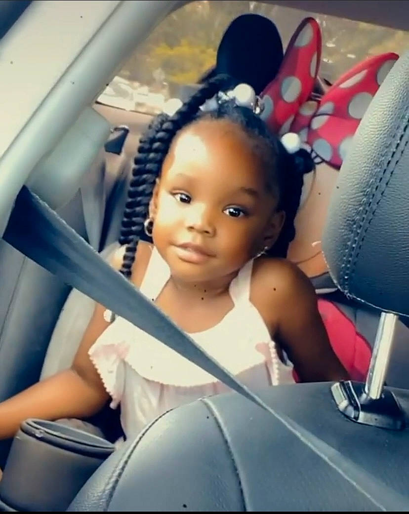 Dalani is registered to the contest to win money with this photo: auto_part, automotive_design, automotive_exterior, black_hair, car_seat, child, cool, doll, eyelash, fashion_design, flash_photography, fun, hairstyle, happy, iris, long_hair, person, product, skin, toy