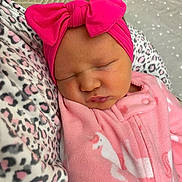 Kambrye is registered to the contest to win money with this photo: newborn, baby, sleeping, pink, headband, bow, onesie, unicorn, blanket, leopard_print, soft, cozy, portrait, infant, cute, peaceful, closeup, child, resting, clothing