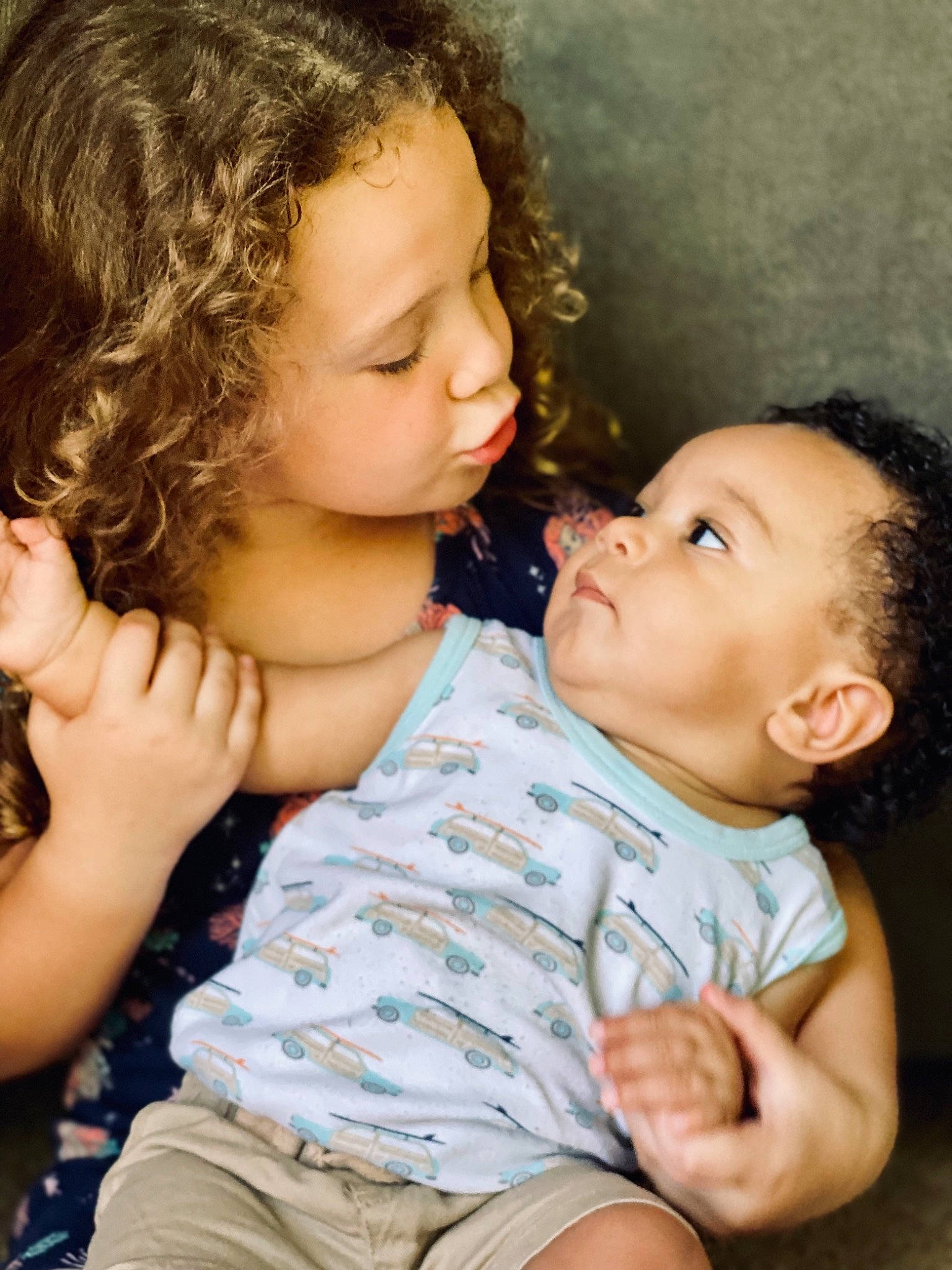 Delilah joined the competition — help win amazing prizes! baby_toddler_clothing, cheek, chin, finger, gesture, hair, hand, happy, head, human_body, interaction, iris, lip, mouth, neck, nose, person, shoulder, skin, standing