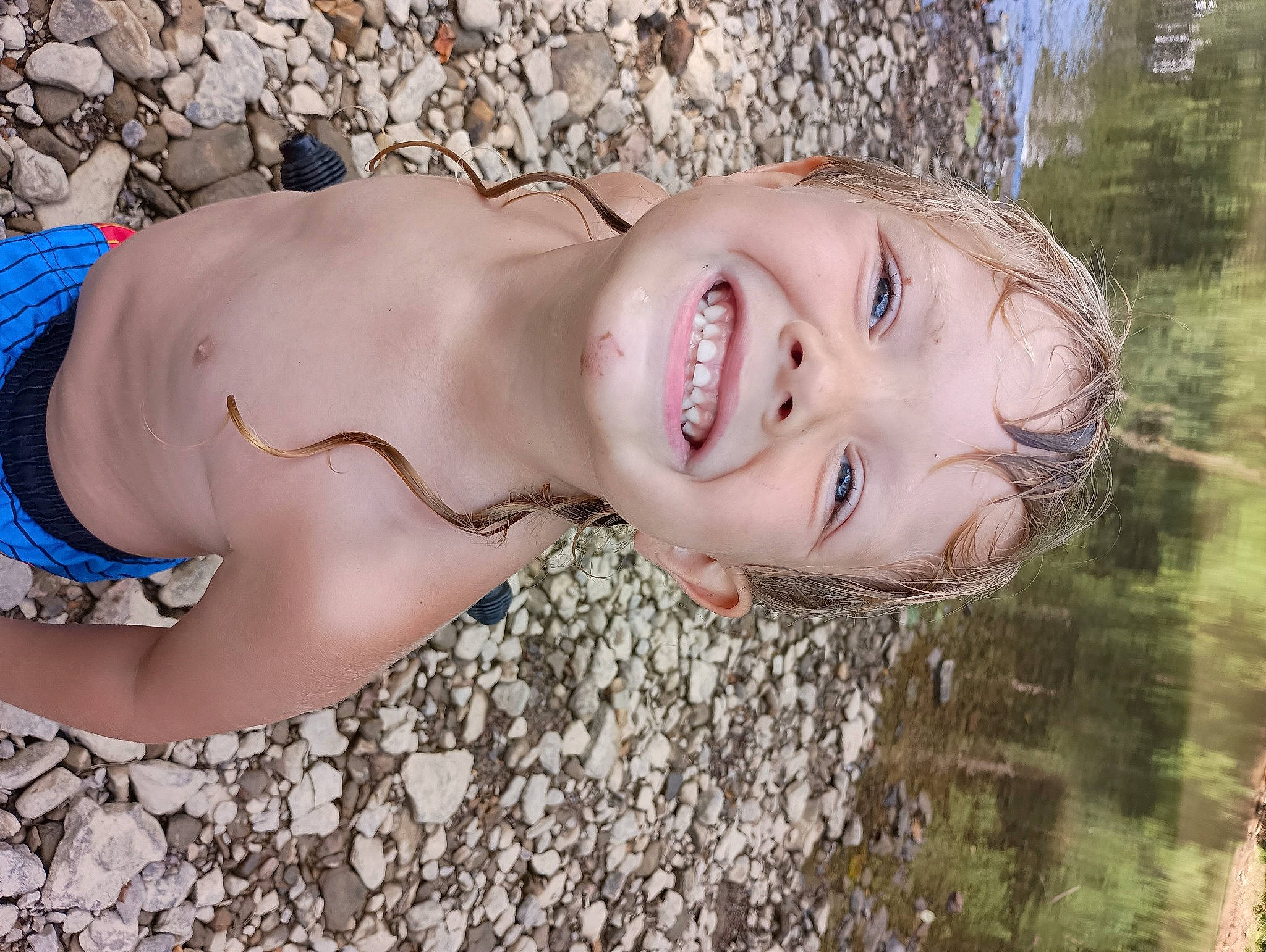 Korbin is registered to the contest to win money with this photo: abdomen, barechested, beach, blond, chest, child, fun, grass, happy, headgear, human_leg, joy, landscape, laugh, leisure, lip, people_in_nature, person, smile, swimwear