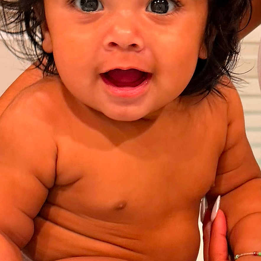 Asher Osiel joined the competition — help win amazing prizes! baby, child, smiling, happy, sitting, skin, hair, face, eyes, mouth, fingers, nails, person, infant, cute, closeup, indoors, expression, joy, toddler