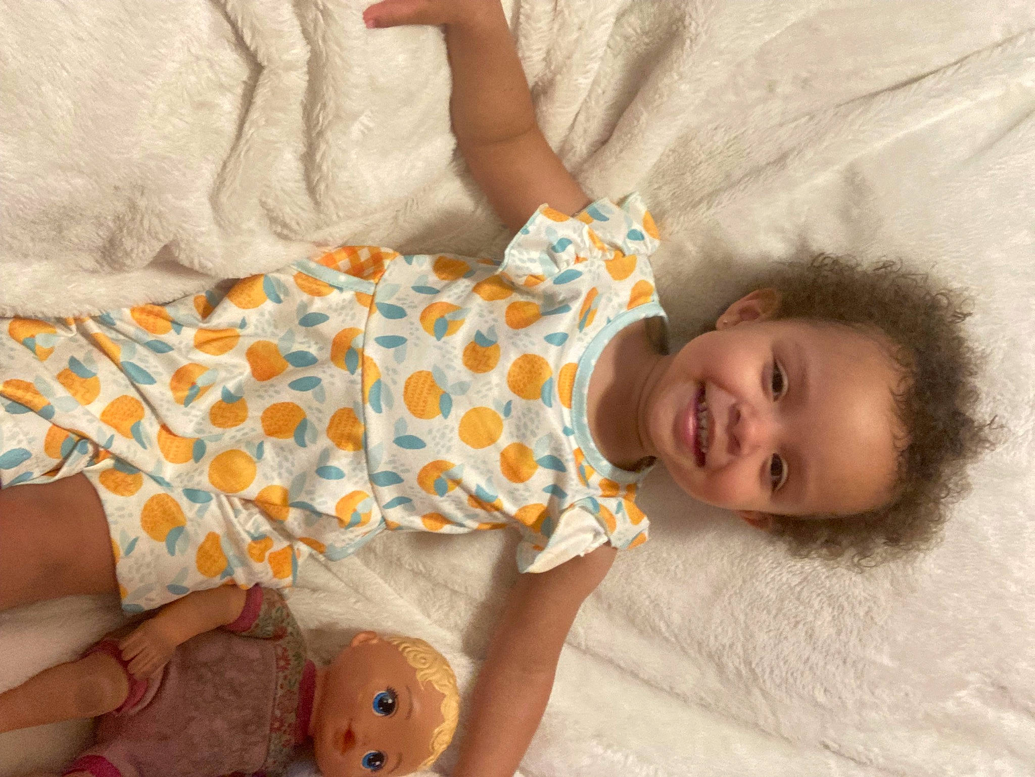 Kyndell is registered to the contest to win money with this photo: baby, baby_products, baby_sleeping, baby_toddler_clothing, child, comfort, finger, hand, happy, human_leg, joy, linens, mammal, nose, orange, pattern, person, skin, smile, textile
