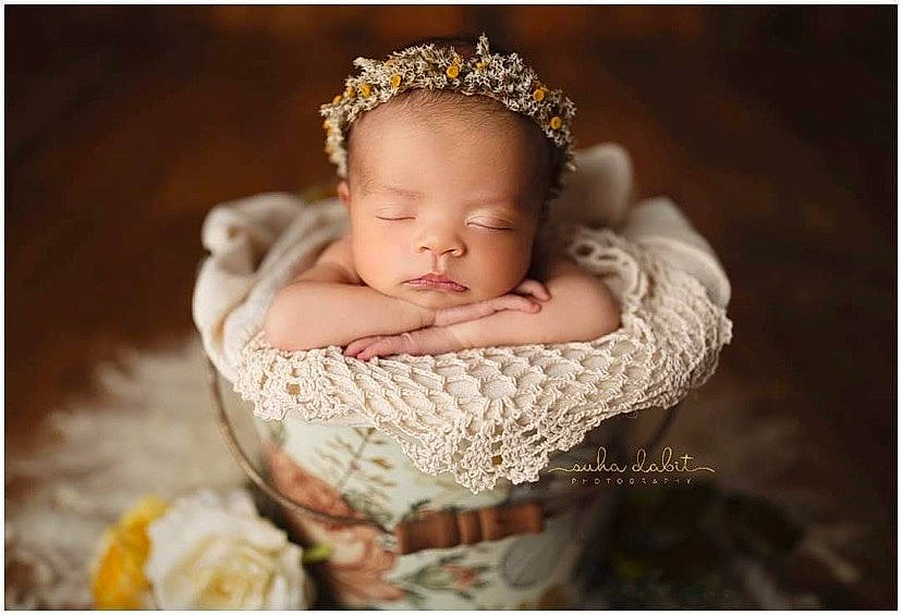Kyndell is registered to the contest to win money with this photo: baby, baby_products, baby_sleeping, baby_toddler_clothing, bridal_accessory, chair, comfort, dress, embellishment, event, flash_photography, hand, happy, headband, headgear, headpiece, iris, jewellery, pearl, person