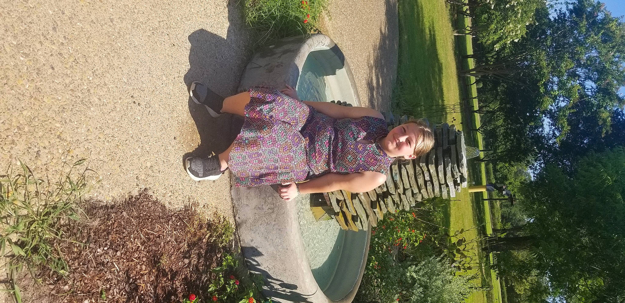 Tessa is registered to the contest to win money with this photo: fun, garden, grass, grass_family, happy, joy, landscape, leaf, leisure, pattern, people_in_nature, person, plant, recreation, shrub, sitting, soil, tints_and_shades, tree