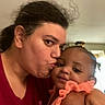 Cameron joined the competition — help win amazing prizes! adult, baby, affection, kiss, indoor, person, child, hair_accessories, smile, warm_lighting, closeup, casual_clothing, family, love, parent_and_child, portrait, skin_tone, happy, cute, toddler