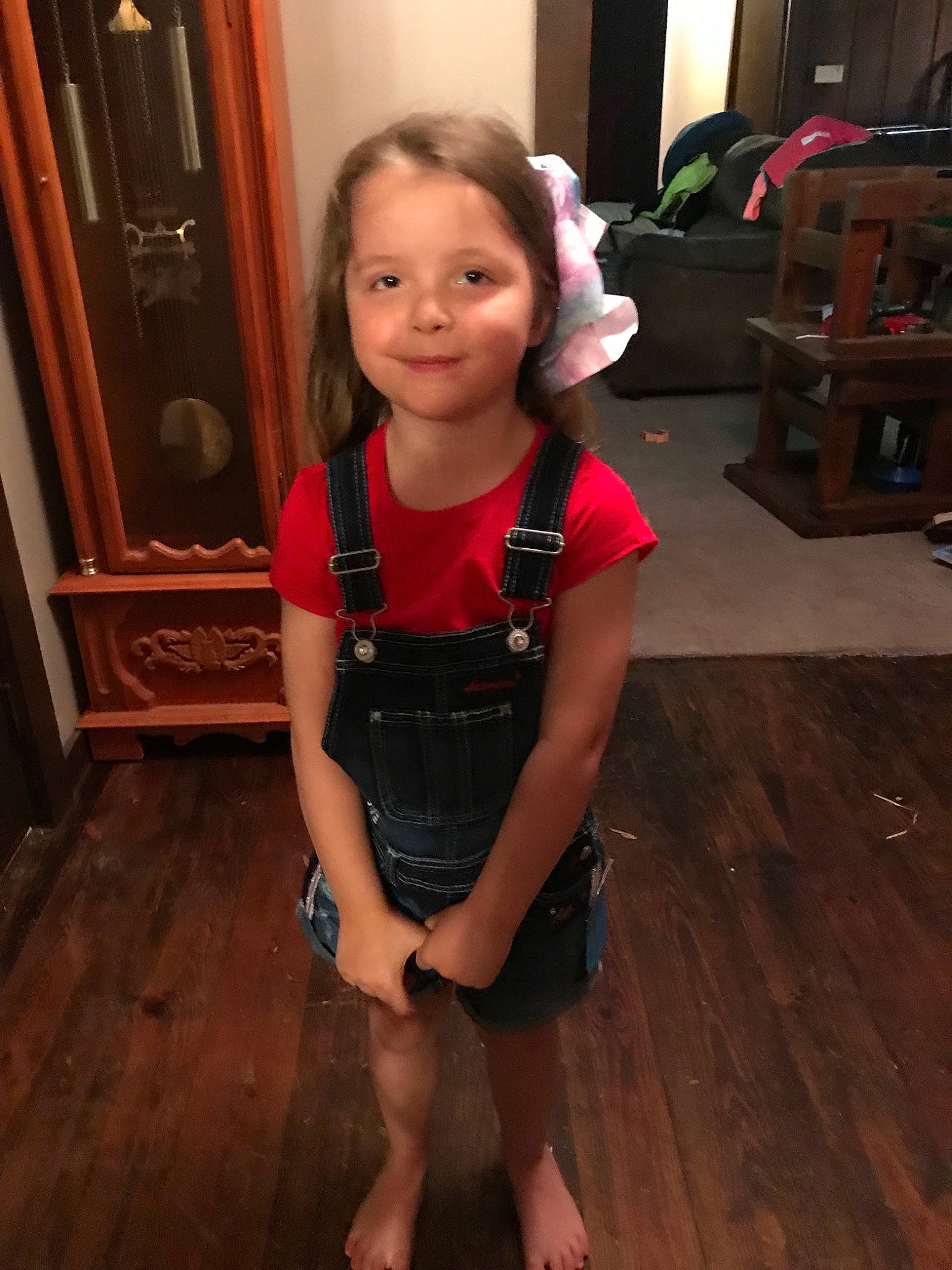 Amelia joined the competition — help win amazing prizes! arm, child, dress, flooring, hardwood, human_leg, joint, leg, person, shoulder, smile, standing, toddler