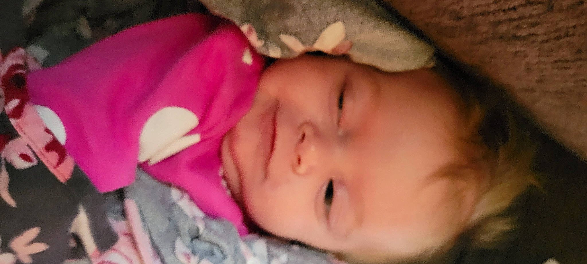 Emerson Byers is registered to the contest to win money with this photo: baby, baby_toddler_clothing, beauty, cheek, child, comfort, eyebrow, eyelash, finger, forehead, grass, headgear, iris, lip, mouth, nose, person, pink, plant, skin