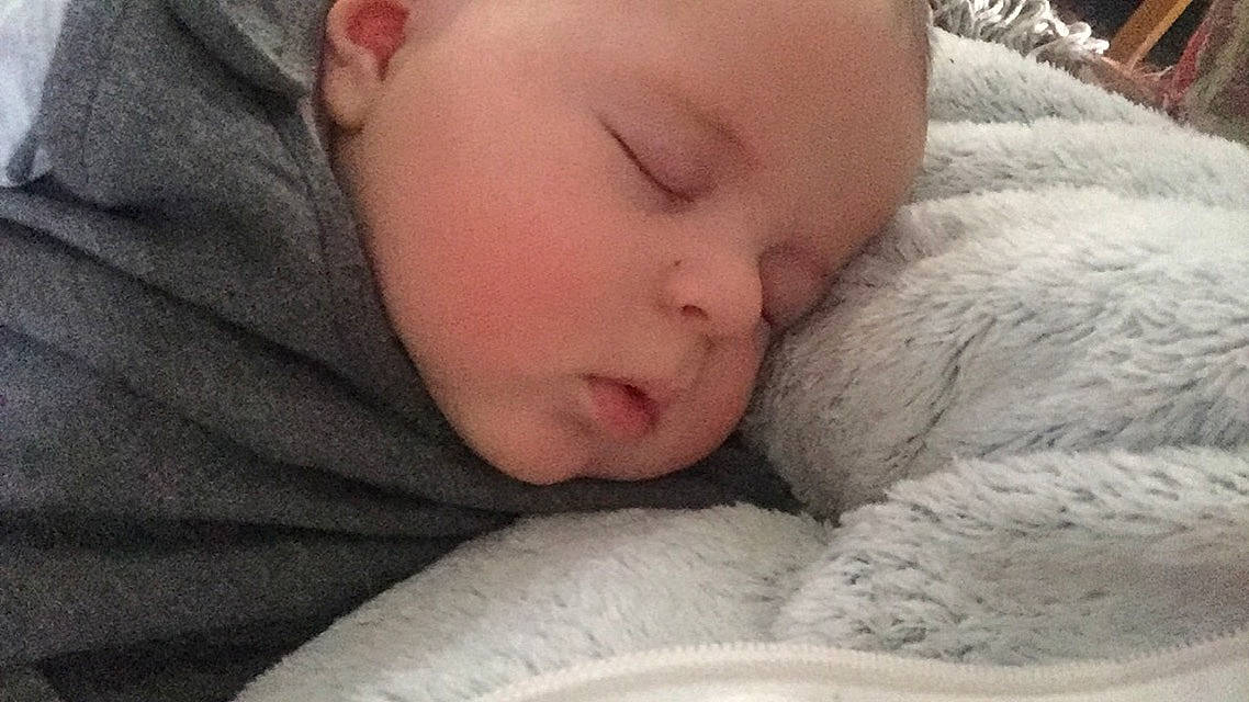 Clay is registered to the contest to win money with this photo: baby, baby_sleeping, bed, bedtime, cheek, child, childbirth, comfort, ear, eyelash, fur, gesture, iris, linens, mouth, nap, nose, person, skin, toddler