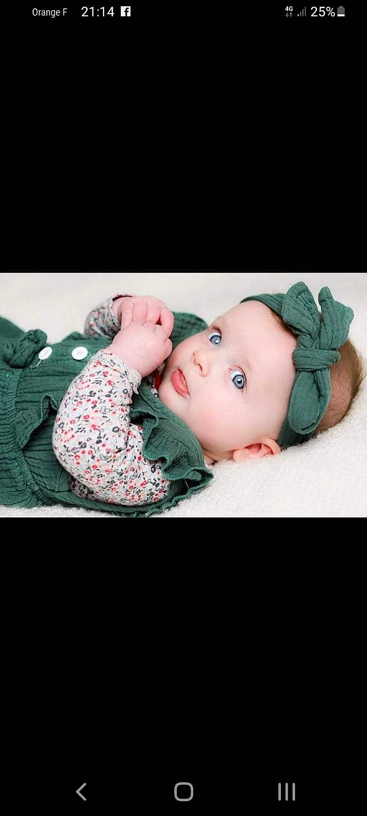 Aélya participe au concours pour gagner de l'argent avec cette photo : baby, baby_products, baby_toddler_clothing, beanie, cap, cheek, comfort, eyelash, fashion_accessory, flash_photography, fur, grass, happy, headgear, headwear, linens, lip, pattern, person, sitting