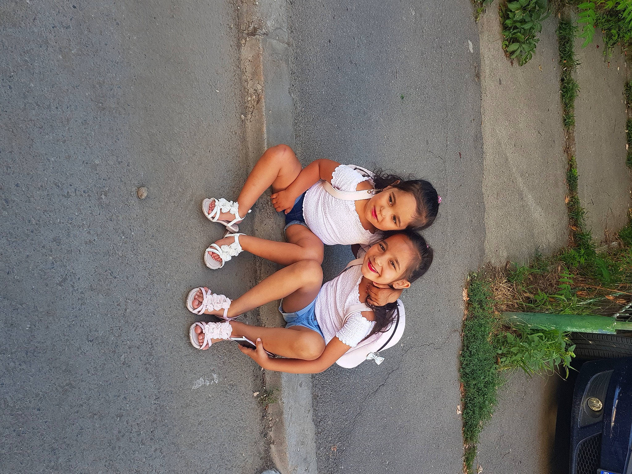 Amalia joined the competition — help win amazing prizes! asphalt, child, foot, fun, happy, human_leg, joy, leg, leisure, pedestrian, person, plant, recreation, road, shorts, sidewalk, smile, street, thigh, toddler