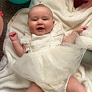 Drixley Dream is registered to the contest to win money with this photo: baby, balloon, celebration, child, chubby_arms, chubby_legs, closeup, cute, dress, happy, indoors, infant, joy, laying_down, person, portrait, smile, soft_texture, tulle, white_blanket