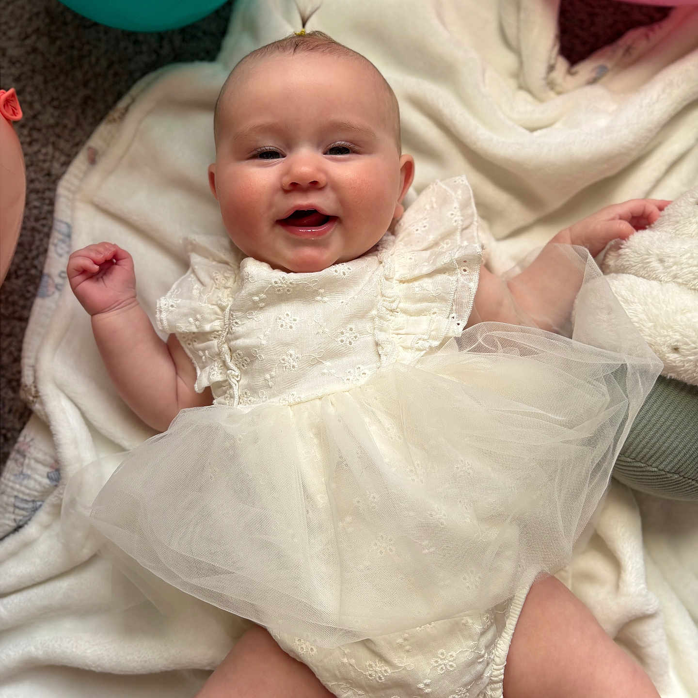 Drixley Dream is registered to the contest to win money with this photo: baby, balloon, celebration, child, chubby_arms, chubby_legs, closeup, cute, dress, happy, indoors, infant, joy, laying_down, person, portrait, smile, soft_texture, tulle, white_blanket