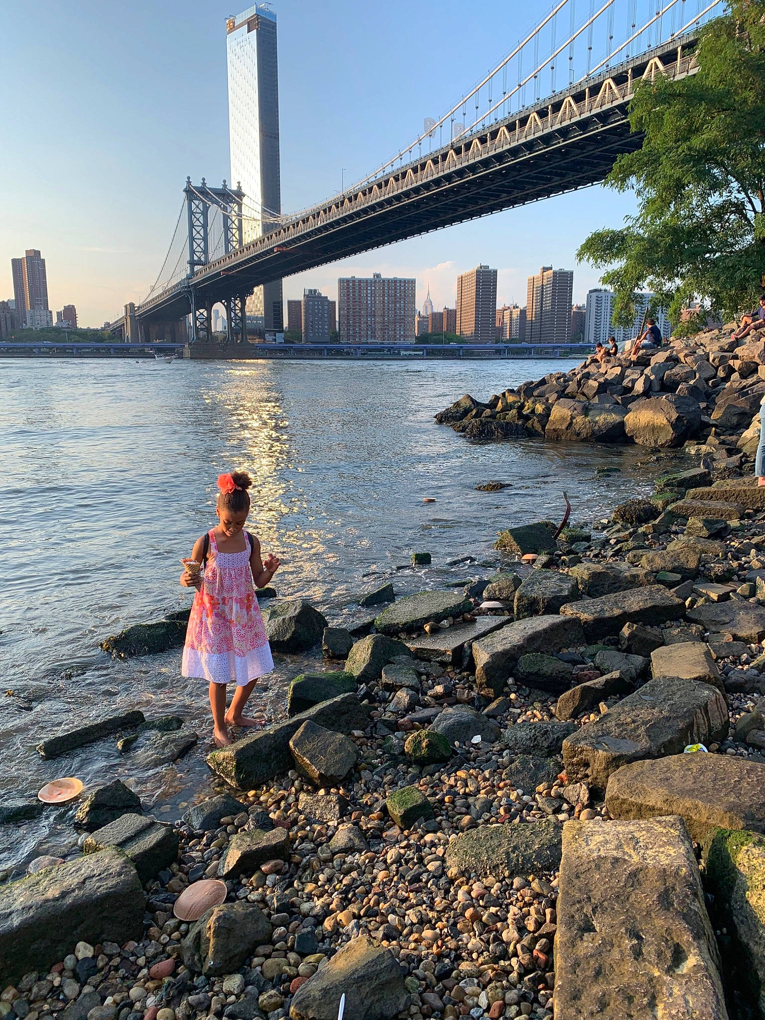 Tori is registered to the contest to win money with this photo: architecture, bank, bay, bridge, city, coast, dress, horizon, landmark, nonbuilding_structure, ocean, person, river, rock, sea, sky, tourism, tree, urban_area, vacation