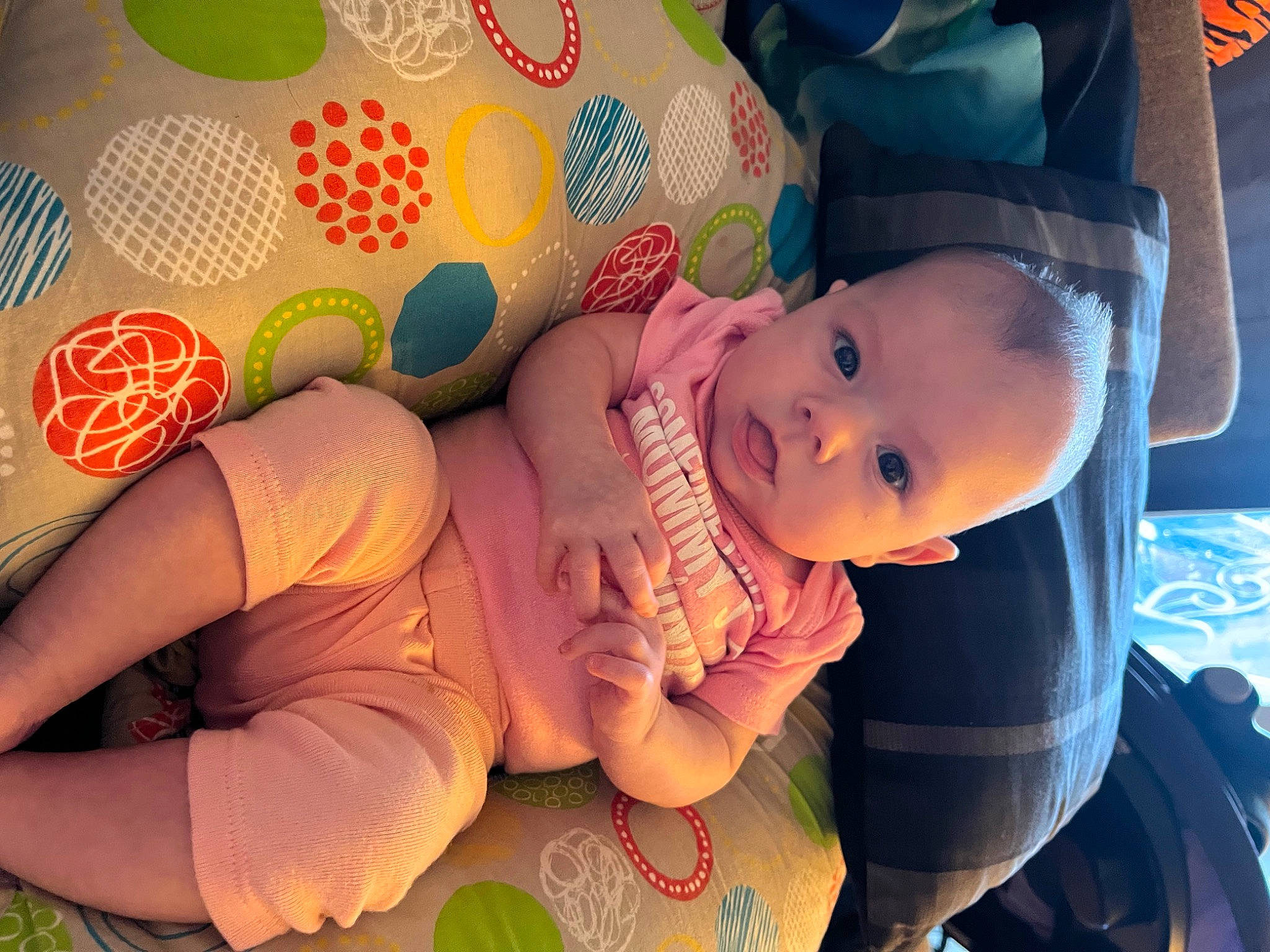 Sophia Mae Wilson is registered to the contest to win money with this photo: arm, baby, baby_toddler_clothing, child, finger, fun, grass, hand, happy, hat, human_body, human_leg, leg, mouth, pattern, person, plant, skin, textile, thigh