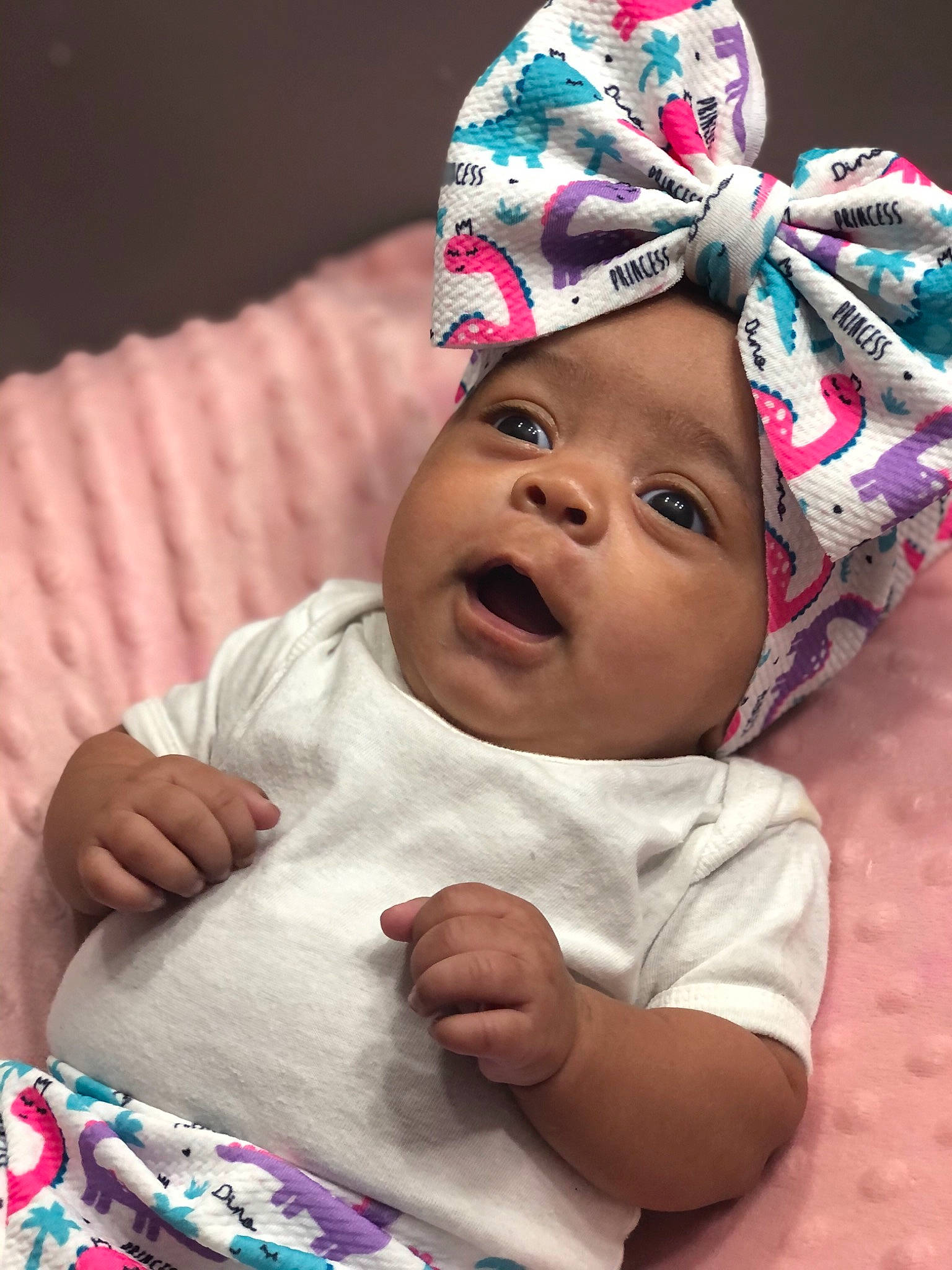 Maleah is registered to the contest to win money with this photo: baby, baby_sleeping, baby_toddler_clothing, cap, cheek, child, comfort, face, finger, fun, gesture, happy, headgear, headwear, linens, person, pink, purple, skin, smile